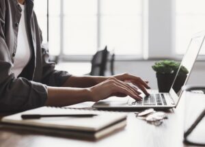 Woman's hands on a computer