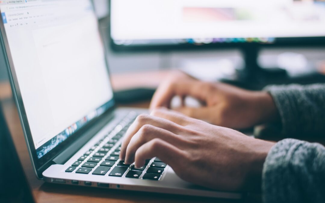 Person typing on the computer