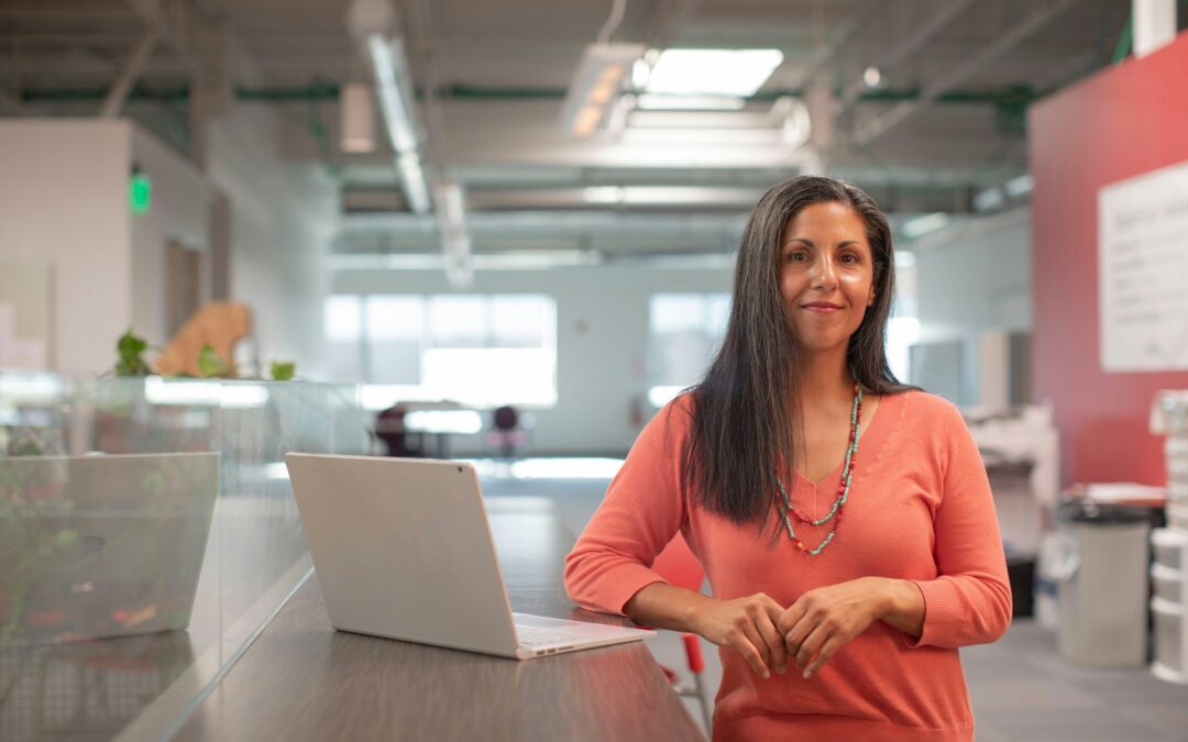 Woman business owner by a computer