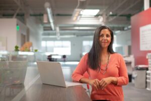 Woman business owner by a computer